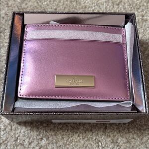 Kate Spade Pink metallic Card Holder NWT. Comes with Kate spade box.